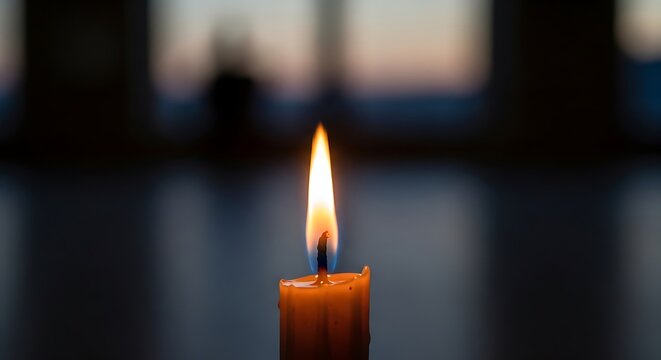 Flickering Candle Flame: Hope in Darkness