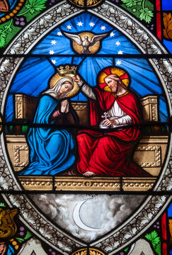 Stained glass (19th century) of Coronation of the Virgin Mary, Mother of God, in heaven.