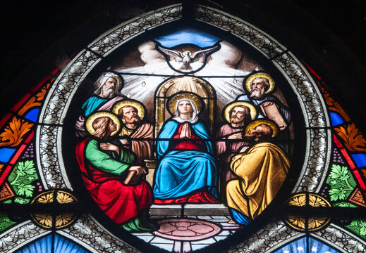 Stained glass (19th century) of Pentecost Sunday: The Holy Spirit Comes and descending on disciples as Tongues of Fire.