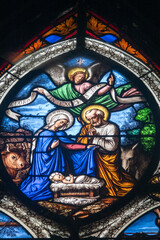 Stained glass (19th century) of Christmas Nativity Scene with Virgin Mary, Saint Joseph, and Jesus baby.