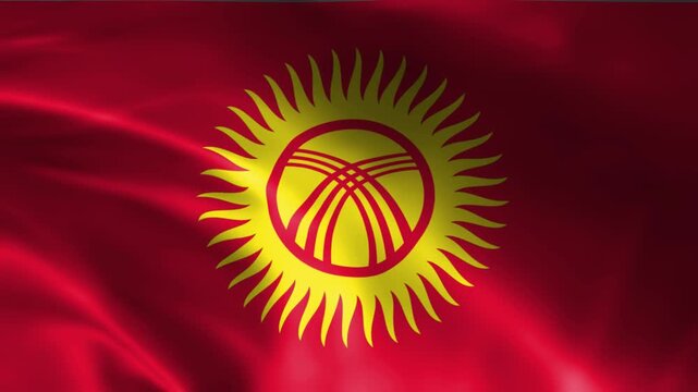 waving national flag of kyrgyzstan with radiant sun and tunduk emblem on red fabric texture background