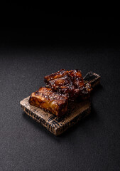Grilled or bbq pork ribs with sauce, a food prepared for dinner. Grilled ribs