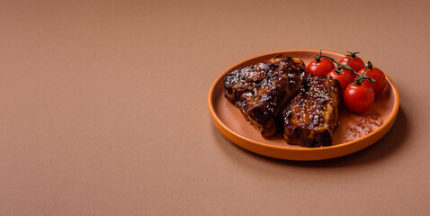 Grilled or bbq pork ribs with sauce, a food prepared for dinner. Grilled ribs
