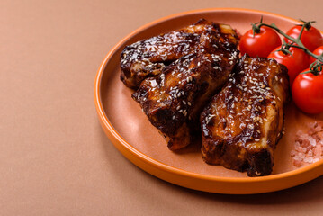 Grilled or bbq pork ribs with sauce, a food prepared for dinner. Grilled ribs