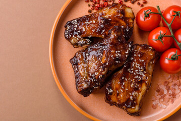 Grilled or bbq pork ribs with sauce, a food prepared for dinner. Grilled ribs