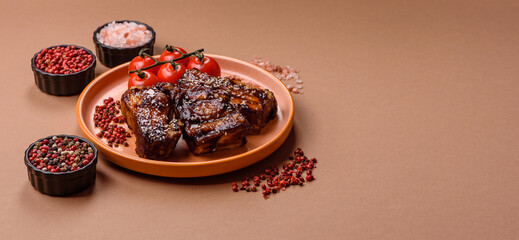 Grilled or bbq pork ribs with sauce, a food prepared for dinner. Grilled ribs