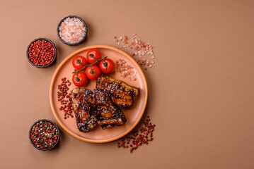 Grilled or bbq pork ribs with sauce, a food prepared for dinner. Grilled ribs