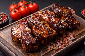 Grilled or bbq pork ribs with sauce, a food prepared for dinner. Grilled ribs