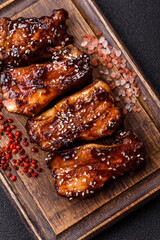 Grilled or bbq pork ribs with sauce, a food prepared for dinner. Grilled ribs