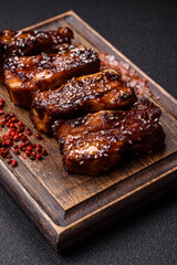 Grilled or bbq pork ribs with sauce, a food prepared for dinner. Grilled ribs