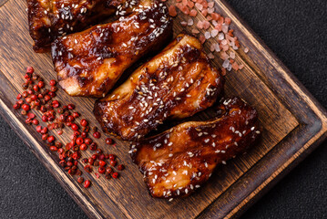 Grilled or bbq pork ribs with sauce, a food prepared for dinner. Grilled ribs