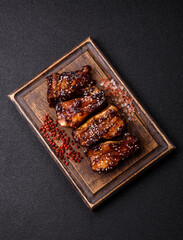 Grilled or bbq pork ribs with sauce, a food prepared for dinner. Grilled ribs