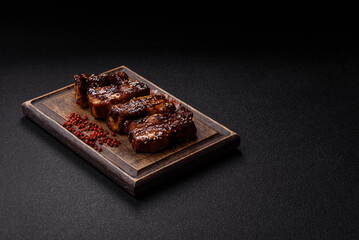 Grilled or bbq pork ribs with sauce, a food prepared for dinner. Grilled ribs