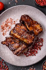 Grilled or bbq pork ribs with sauce, a food prepared for dinner. Grilled ribs