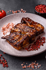 Grilled or bbq pork ribs with sauce, a food prepared for dinner. Grilled ribs