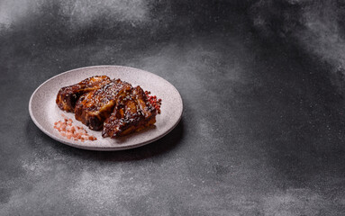 Grilled or bbq pork ribs with sauce, a food prepared for dinner. Grilled ribs