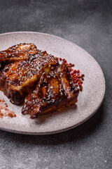 Grilled or bbq pork ribs with sauce, a food prepared for dinner. Grilled ribs