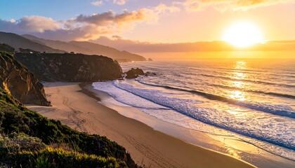 Obraz premium Coastal sunset over a sandy beach with cliffs, ocean waves, and warm golden light