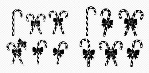 Set of black and white candy canes with bows, isolated on transparent background, for Christmas and holiday designs.