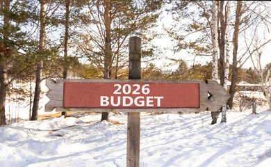 2026 Budget symbol. Concept words 2026 Budget on beautiful wooden road sign. Beautiful winter forest background. Business and 2026 budget concept. Copy space.