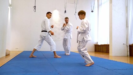 Sportsmen in Kimano are engaged in martial arts - Powered by Adobe