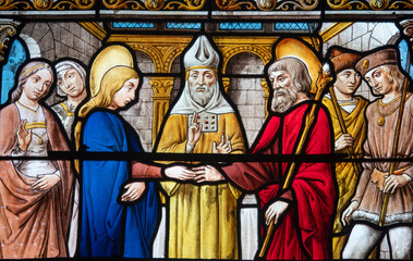 Fototapeta premium Stained glass (19th century) of Holy family: The wedding of Mary and Joseph.