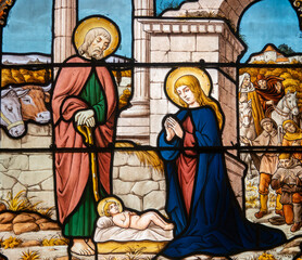 Fototapeta premium Stained glass (19th century) of Christmas Nativity Scene with Virgin Mary, Saint Joseph, and Jesus baby.