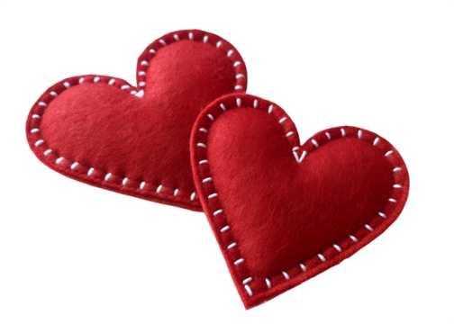 Two red felt hearts with white stitching isolated on transparent background