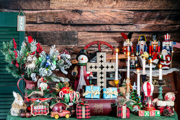 maximalist Christmas with wooden cross and Bible surrounded by classic Christmas presents