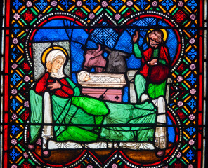 Fototapeta premium Stained glass (19th century) of Christmas Nativity Scene with Virgin Mary, Saint Joseph, and Jesus baby.