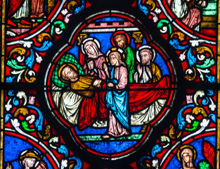 Stained glass (19th century) of Death of Saint Joseph surrounded by Mary and Jesus.