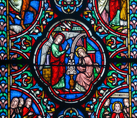 Naklejka premium Stained glass (19th century) of Annunciation to the Blessed Virgin Mary by the Archangel Gabriel.