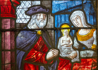 Stained glass (16th century) of the young Virgin Mary with her parents Saint Anne and Saint Joachim.