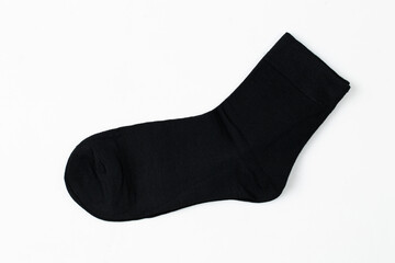Black socks on a white background Casual clothing.