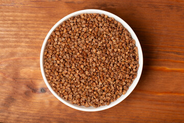 Buckwheat. Buckwheat grains on a dark background.