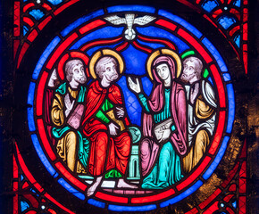 Stained glass (19th century) of Pentecost Sunday: The Holy Spirit Comes and descending on disciples as Tongues of Fire.