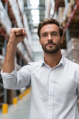 Obraz premium Proud Logistician Celebrating Successful Inventory Count in Warehouse