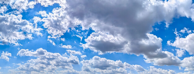 Dynamic detailed massive banner with copy space inscription.. Blue cirrus sky filled many white feather clouds creating a peaceful and inspiring natural landscape scene.