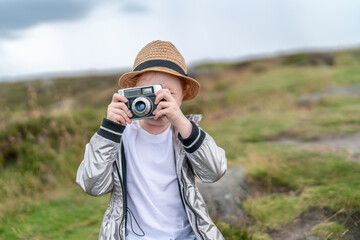 Young photographer capturing nature on a cloudy day