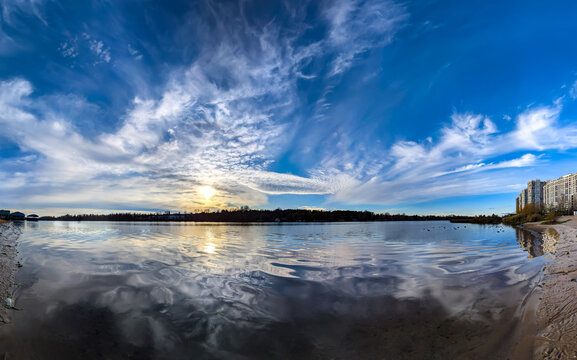 A raster image of a some cloud photographed against a blue sky. Easy relaxed cottony shape. Reflection volume in river. Fiber contours after rain. Lonely free substance water. Trivial form of freedom.
