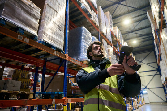 Warehouse worker scanning inventory in cold chain logistics