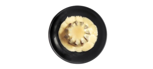 Chocolate Pudding with Creamy Vanilla Sauce  Custard on Black Plate Isolated on White Background. Food Stylish Photography