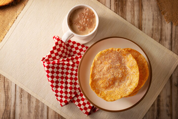 Buñuelos de rodilla. Traditional food at Christmas and winter holidays in Mexico, these are fried dough flour sprinkled with sugar or covered in a syrup made with piloncillo, cinnamon, and guava.