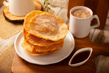 Buñuelos de rodilla. Traditional food at Christmas and winter holidays in Mexico, these are fried dough flour sprinkled with sugar or covered in a syrup made with piloncillo, cinnamon, and guava.