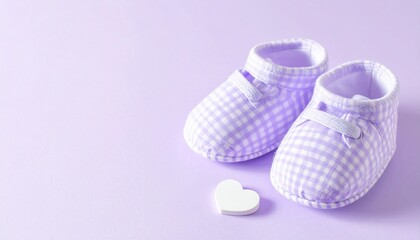 Adorable Lavender Gingham Baby Booties and White Heart on Lilac Background with Copy Space.
