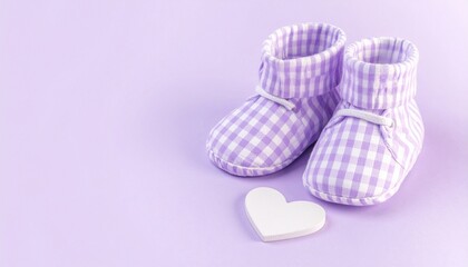 Sweet Lavender Gingham Baby Booties and White Heart. Newborn Arrival and Pregnancy Announcement Concept.