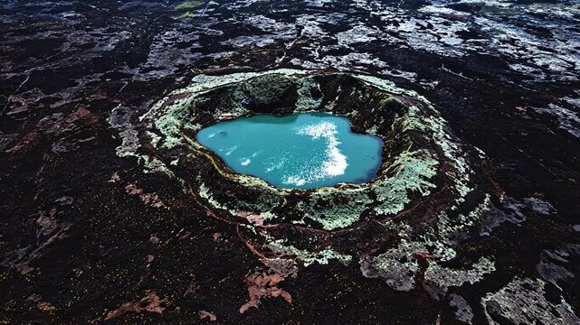Volcanic crater lake surrounded by lava