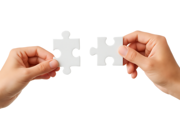Two human hands holding matching white jigsaw puzzle pieces connecting together on white background
