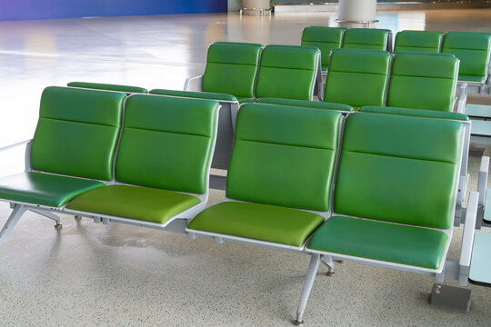 close up on green color airport seats