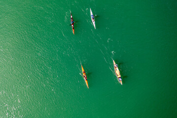 Canoe and kayaks on a river seen from above